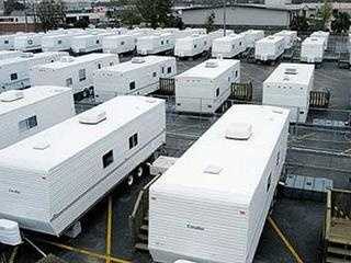 Collection of white fema trailers waiting to be distributed after Hurricane Ida